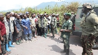 EACRF troops deployed in Kibumba, eastern DR Congo speak with locals