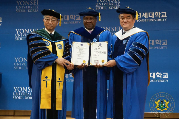 President John Dramani Mahama (M) being honored with PhD degree in Public Administration