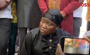 Afia Pokua kneeling before chiefs and elders at the Manhyia Palace