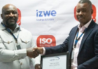 An official of Izwe receiving the certification