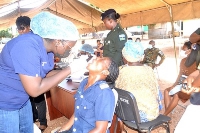 Doctors checking the teeth of people