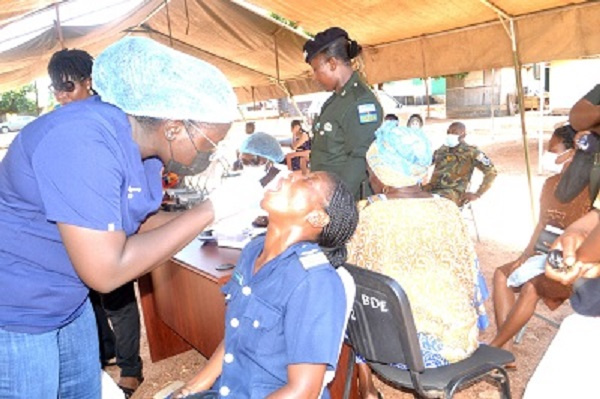 Doctors checking the teeth of people