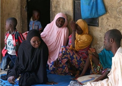Relatives of missing school girls react in Dapchi in the northeastern state of Yobe
