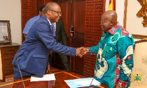 President Akufo-Addo (R) charged Dr Addison to help ensure economic growth