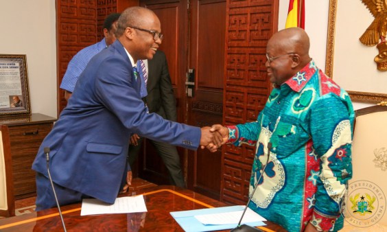 President Akufo-Addo (R) charged Dr Addison to help ensure economic growth