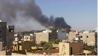 Smoke rises amid clashes between armed factions in Tripoli, Libya on August 15, 2023.