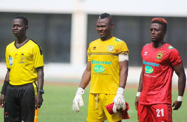 Asante Kotoko goalkeeper, Danlad Ibrahim and Patrick Asmah (standing next to his left)