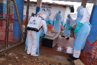 Health workers disinfects an ambulance at Ebola Treatment Centre at Bunia General Hospital in Ituri