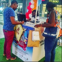 Shoppers at Achimota Mall complete entry forms