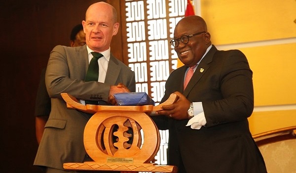 Irish Ambassador to Ghana, Sean Hoy (left) being presented with a traditional stool and other gifts