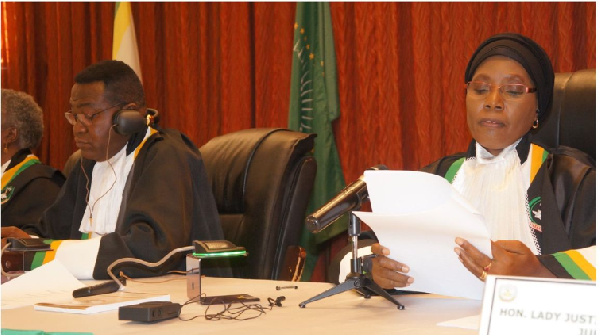 African Court Judge Hon Justice Imani Aboud (R) reading a judgment