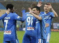 Francis Narh is congratulated by his team-mates for scoring