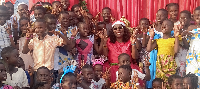 Judith Adjobah Blay having fun with some of the children