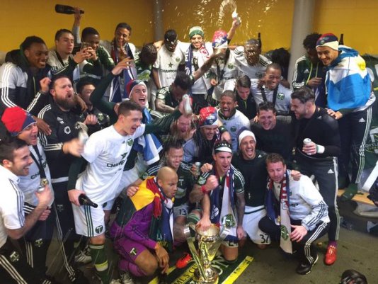 Kwarasey seen with his Ghana flag as he celebrate Timbers title success
