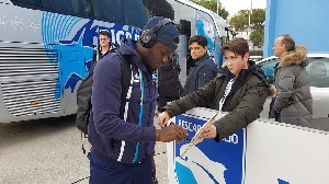 Sulley Muntari signing autographs for Pescara fans before kick off the game against Lazio
