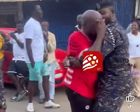 The Kotoko fan sobbing while a police man tries to console him