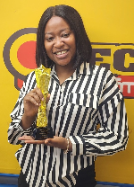 OTEC FM’s news anchor, Maame Adwoa Nyanta Tando with her award
