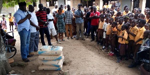 Ansah presents items to Obuotumpan MA Basic to help refurbish the school's roof