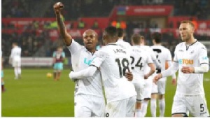 Andre Ayew celebrating with his team members after securing a goal for Swansea