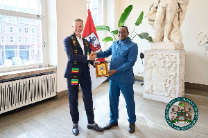 Mayor of Düsseldorf, Dr Stephan Keller (L) and Frederick Faustinus Faidoo