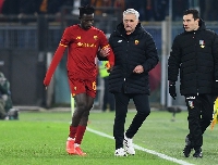 Felix Afena-Gyan being held by Jose Mourinho during a game