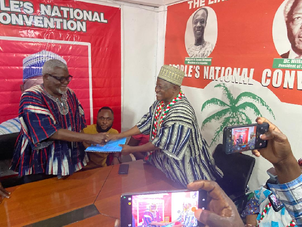 David Apasera (right) submitting his nomination form