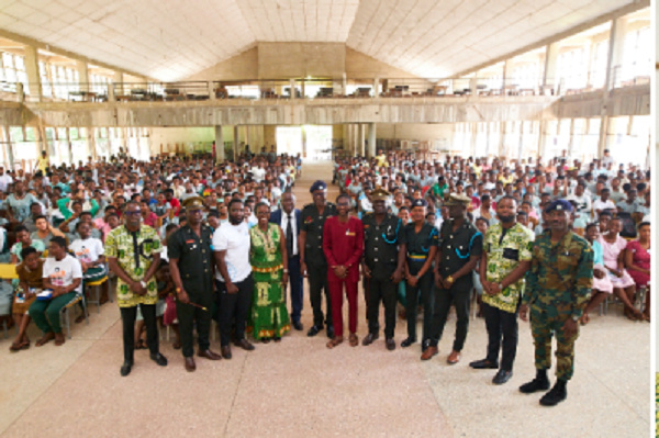 Photo of team with staff and students