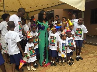 Jackie Appiah with children and staff of N.I.C Safe Haven children