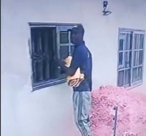 The suspect captured removing the glass window
