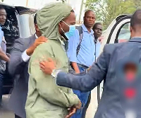 Kailani Ibrahim Kpa being escorted ahead of his court proceedings