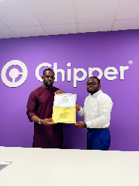 Dion Jon Taylor Samson, Chief Executive Officer of Chipper Cash receiving the license