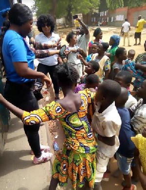 Representatives from KORLIBA Group with some of the street kids