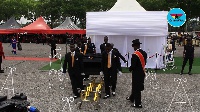 Ebony's remains being carried from the funeral grounds