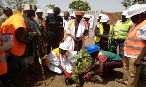 Planting a tree to signify the beginning of the project