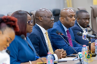 A photo of Dr Cassiel Ato Forson and other officials from IFC