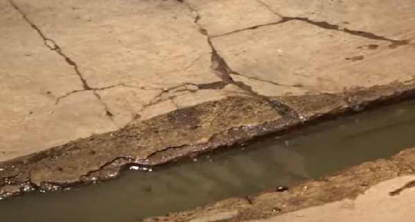 Water seeping from the broken down sewer lines