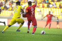 Kotoko's Justice Blay battles against  Medeama's  Prince Owusu for the ball