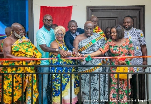 Osagyefo Amoati Ofori Panin II cutting the ribbon for the official opening