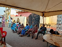 Security personnel are present at various polling centers