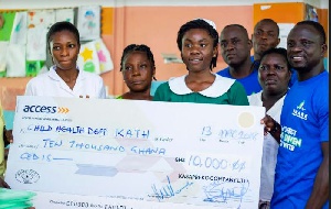 The Awake team presenting a chegue of GHC10,000 to nurses at the KATH as bills for the mothers