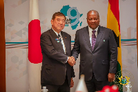 Japanese Prime Minister Shigeru Ishiba in a handshake with President Mahama