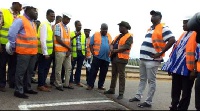Mr Amoako-Atta (3rd right) being conducted round some damaged portions of the bridge
