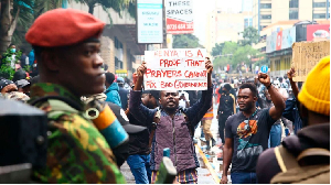 Demonstrators display placards during the Anti-Finance Bill protests in Nairobi on June 20, 2024