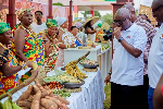 CEO of Ghana Tourism Authority,  Akwasi Agyemang checking some dishes out