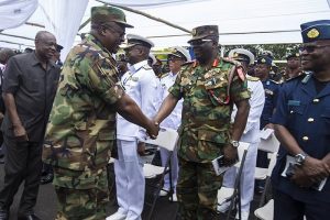 President Mahama in an handshake with other army officer