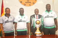 Samartex FC officials present their GPL trophy to Alban Bagbin