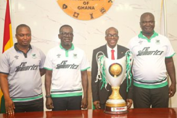 Samartex FC officials present their GPL trophy to Alban Bagbin