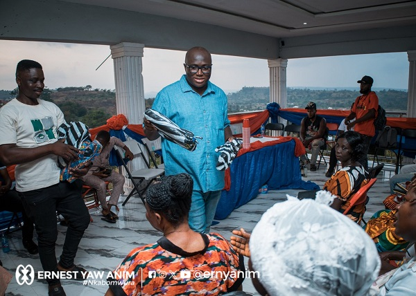 Ernest Anim handing out tools to support constituents