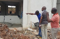 Osei Assibey and Michael Ataogye, KMA Coordinating Director, inspecting work at the Anwomaso project