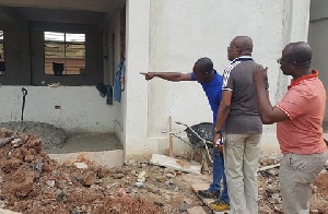 Osei Assibey and Michael Ataogye, KMA Coordinating Director, inspecting work at the Anwomaso project